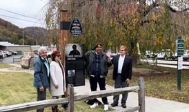 people standing near sign