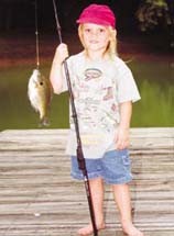 girl holding fishing pole with bluegill