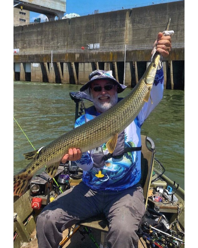Cecil ‘Tank’ Seaton shows a 51” Longnose Gar caught at Watts Bar Reservoir, Tennessee