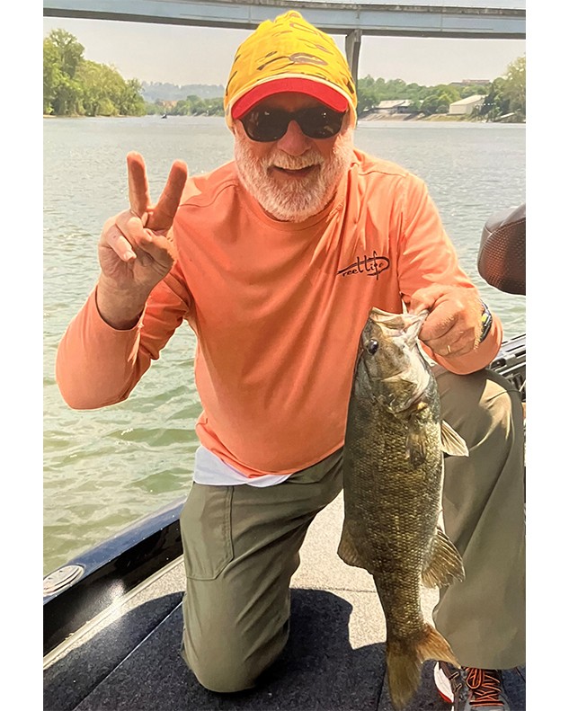 Joseph Willard Jr., shows his 20” Smallmouth Bass he caught on Nickajack Reservoir in Tennessee