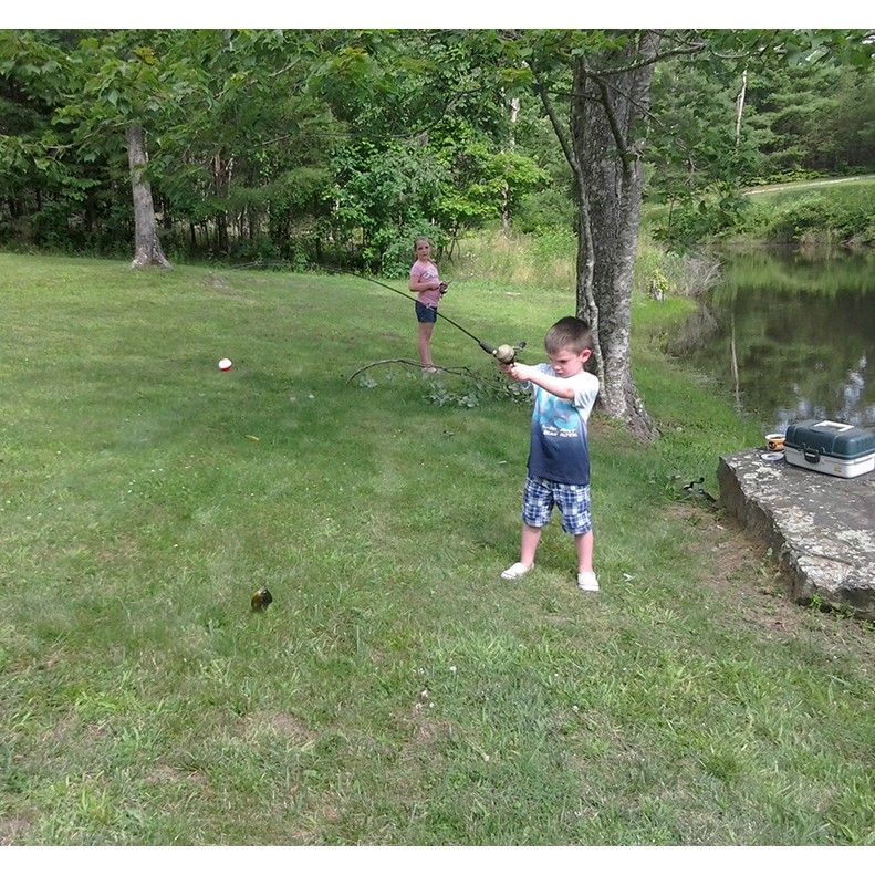 Tavner Hale shows a Bream caught in Grandpa's pond, Crossville TN, on August 22, 2017.