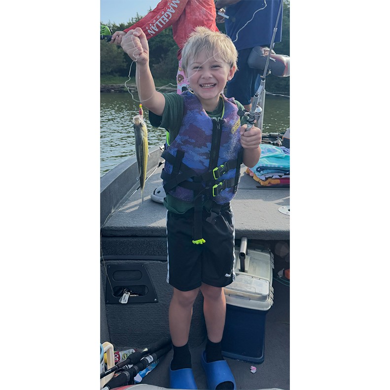 Gunner Ray shows a Striped Bass caught at Percy Priest Lake, TN, on August 22, 2025