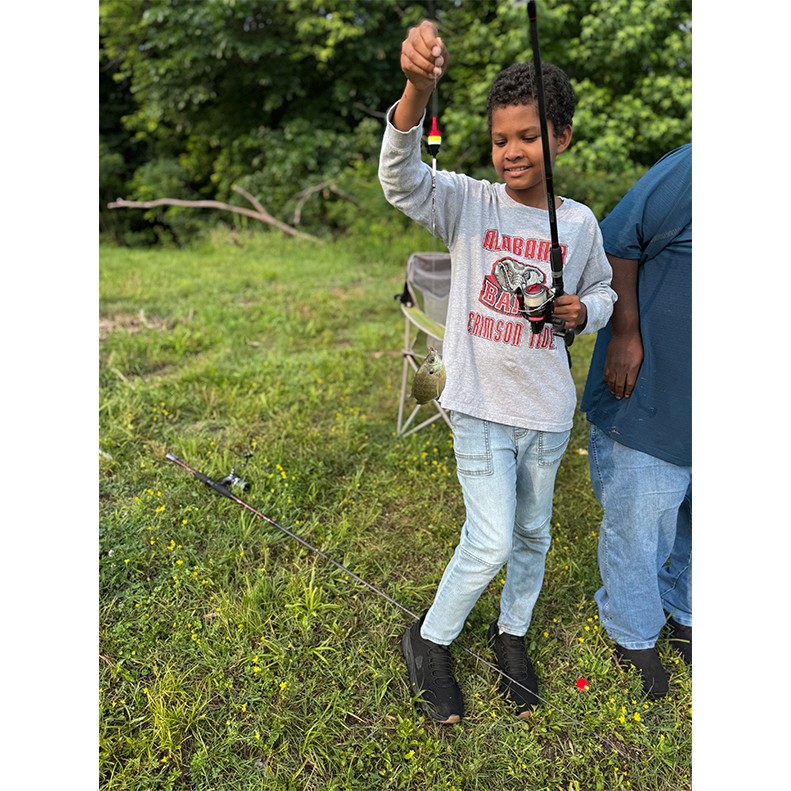 Markeith Jones holds up a Bluegill caught at Cross Creeks, Dover, Tennessee on May 31, 2025.