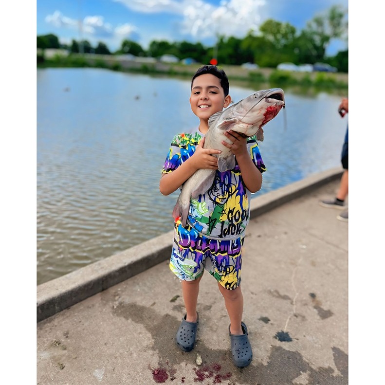  JJ Moore shows off a Blue Catfish caught at Drakes Creek Memorial Park in Hendersonville, Tennessee, on May 30, 2025.