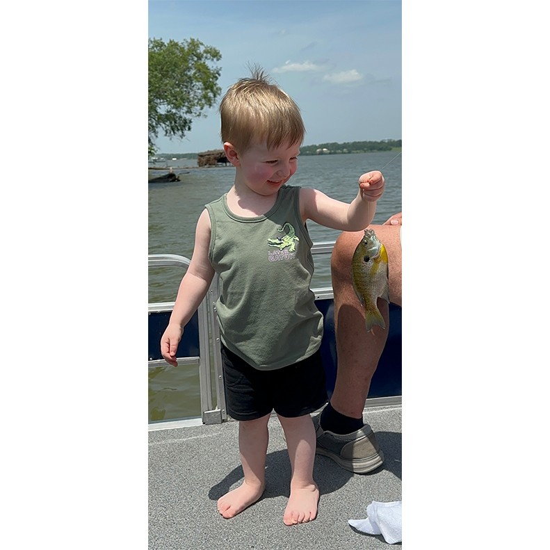 Franklin Anderson holds up his first catch, a Bluegill he caught on Old Hickory Lake in Hendersonville TN, on May 15, 2025