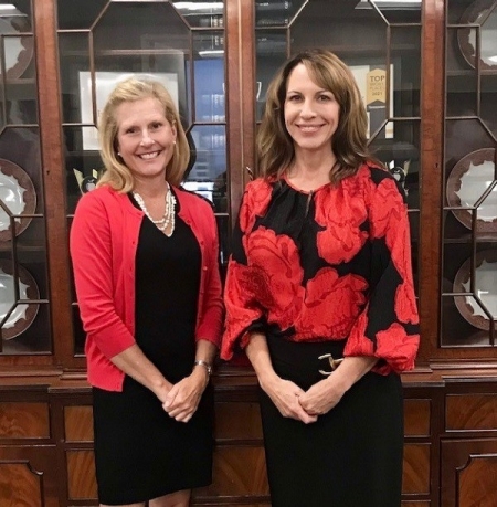 Julie Hannah and Commissioner Christi Branscom wearing red
