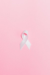 Breast Cancer Awareness A pink ribbon on a pink background