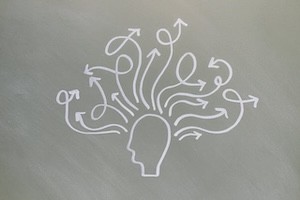 Illustration of a head with arrows going out different ways