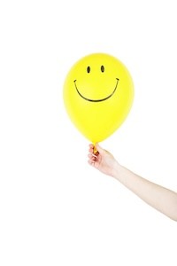 A smiling face emoji balloon