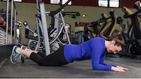 A woman in a modified planking position