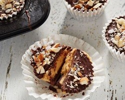 chocolate almond butter cups in paper candy wraps