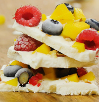 Frozen Yogurt Bark frozen yogurt bark stacked with fruit inside it
