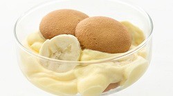 Lightened Up Banana Pudding a small glass dish of banana pudding with vanilla wafers on top