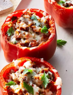 three stuffed red bell peppers