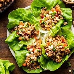 a plate of Asian chicken lettuce wraps