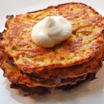 Baked Latkes a small stack of baked latkes topped with a dollop of sour cream