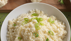 Cauliflower Rice cauliflower rice in a bowl with sliced green onions on top