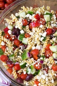 a large bowl of Greek pasta salad