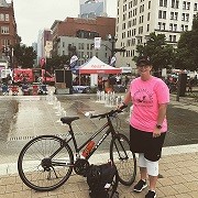 Lindsey standing next to her bicycle