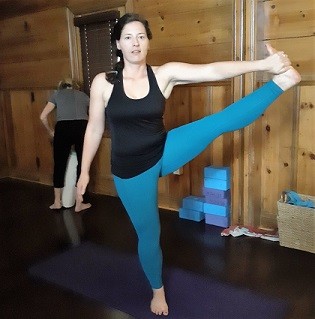 Tara in a yoga pose