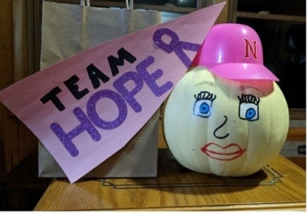 pumpkin decorated for breast cancer awareness