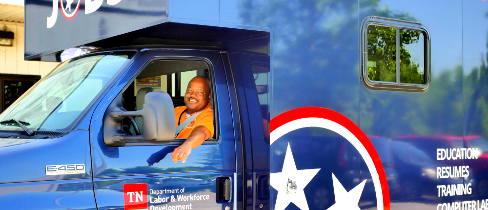 Driver sits in Mobile American Job Center van