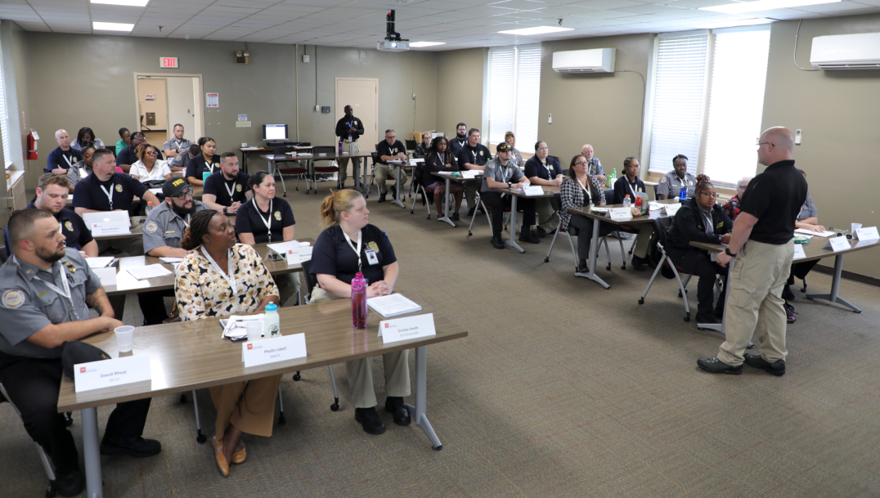 Correctional Academy Class Photo of Classroom Full of Tennessee Department of Correction Employees Learning from instructor leading the class at the front of the room