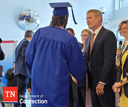 Photo of Governor Lee Speak With Graduates Photo of Graduate Shaking Hands with Governor Bill Lee