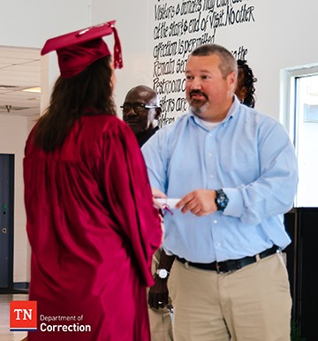 Offender Receiving Diploma Photo of Offender Receiving Diploma