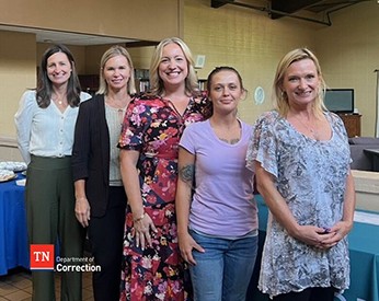 Photo Left to Right: Rachel Morris, Executive Director, The Next Door; Jennifer Boyd, Specialized Services Correctional Administrator, Tennessee Department of Correction; Amanda Dunlap, Clinical Executive Director, The Next Door; Kala B., Graduate; and Dana Davis, Director, The Next Door Photo Left to Right: Rachel Morris, Executive Director, The Next Door; Jennifer Boyd, Specialized Services Correctional Administrator, Tennessee Department of Correction; Amanda Dunlap, Clinical Executive Director, The Next Door; Kala B., Graduate; and Dana Davis, Director, The Next Door