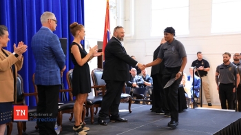 Graduation Ceremony With New Officer Presented Graduation Certificate
