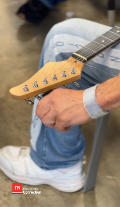 Offender Tuning a Guitar Photo of Offender Tuning a Guitar