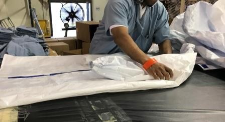 Offenders making gowns at the West Tennessee State Penitentiary.