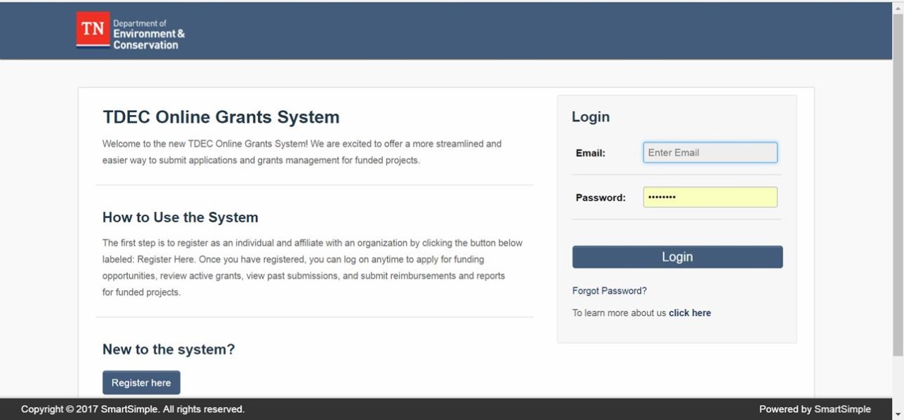 tdec_grants_gms-login-register.jpg the main login page at tdec.smartsimple.com. A button marked "Register here" is in the bottom, left.