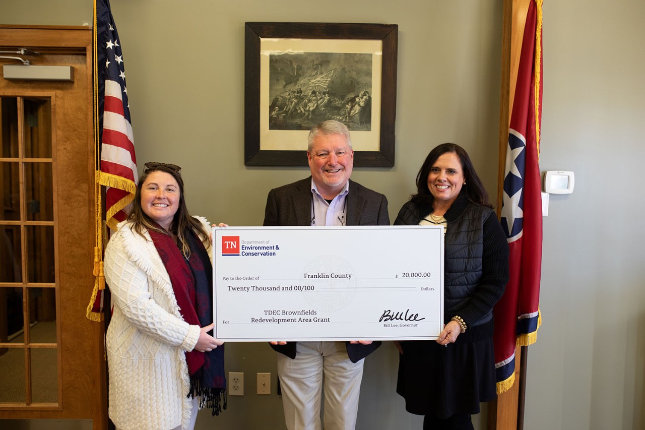 The Tennessee Department of Environment and Conservation presents a check for $20,000 to Franklin County for its plans in brownfield redevelopment. From left are Amy Dyman, coordinator of the Brownfield Redevelopment Area Grant program; Franklin County Mayor Chris Guess; and Chelle Daniels, grants manager for Franklin County.