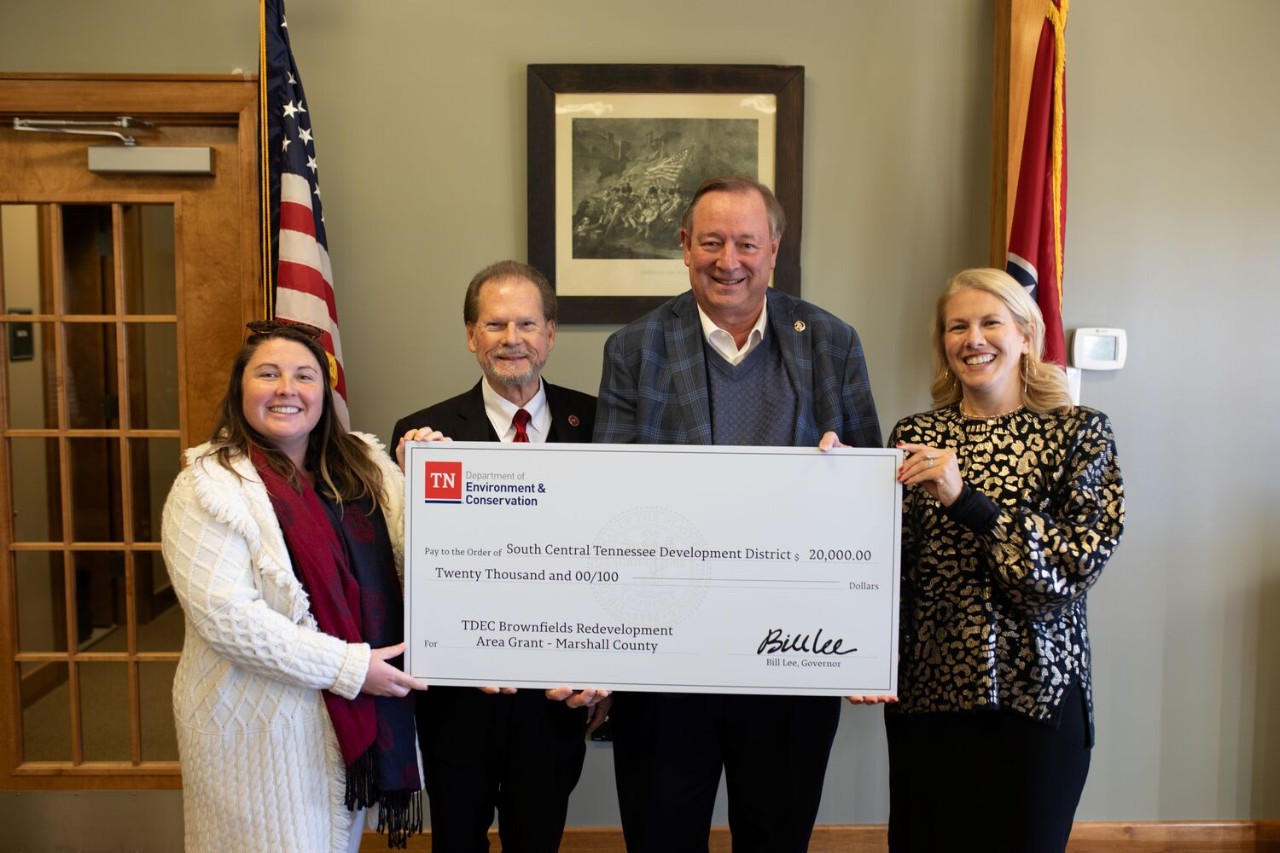 The Tennessee Department of Environment and Conservation (TDEC) presents a check for $20,000 to Marshall County for its plans in brownfield redevelopment. From left are Amy Dyman, coordinator of the Brownfield Redevelopment Area Grant program; Sen. Joey Hensley, R-Hohenwald; Marshall County Mayor Mike Keny; and Lisa Cross, director of Rural Planning Organization/Infrastructure for the South Central Tennessee Development District.