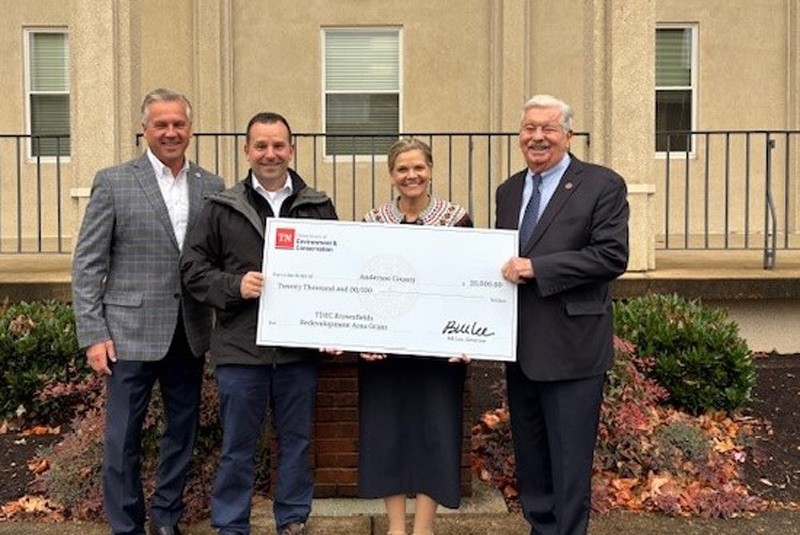 The Tennessee Department of Environment and Conservation (TDEC) presents a check for $20,000 to Anderson County for its plans in brownfield redevelopment. From left are Rep. Rick Scarbrough, R-Oak Ridge; John LeCroy, deputy director of the Division of Stakeholder Engagement for TDEC; Terry Frank, mayor of Anderson County; and Lt. Gov. Randy McNally, R-Oak Ridge.
