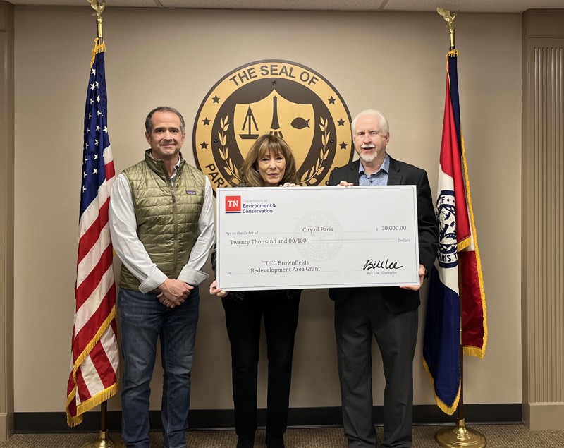 The Tennessee Department of Environment and Conservation (TDEC) presents a check for $20,000 to Paris for its plans in brownfield redevelopment. From left are Rob Goad, executive director of the Paris-Henry County Industrial Committee; Kathy Ray, mayor of Paris; and Rudy Collins, regional director of External Affairs for TDEC.