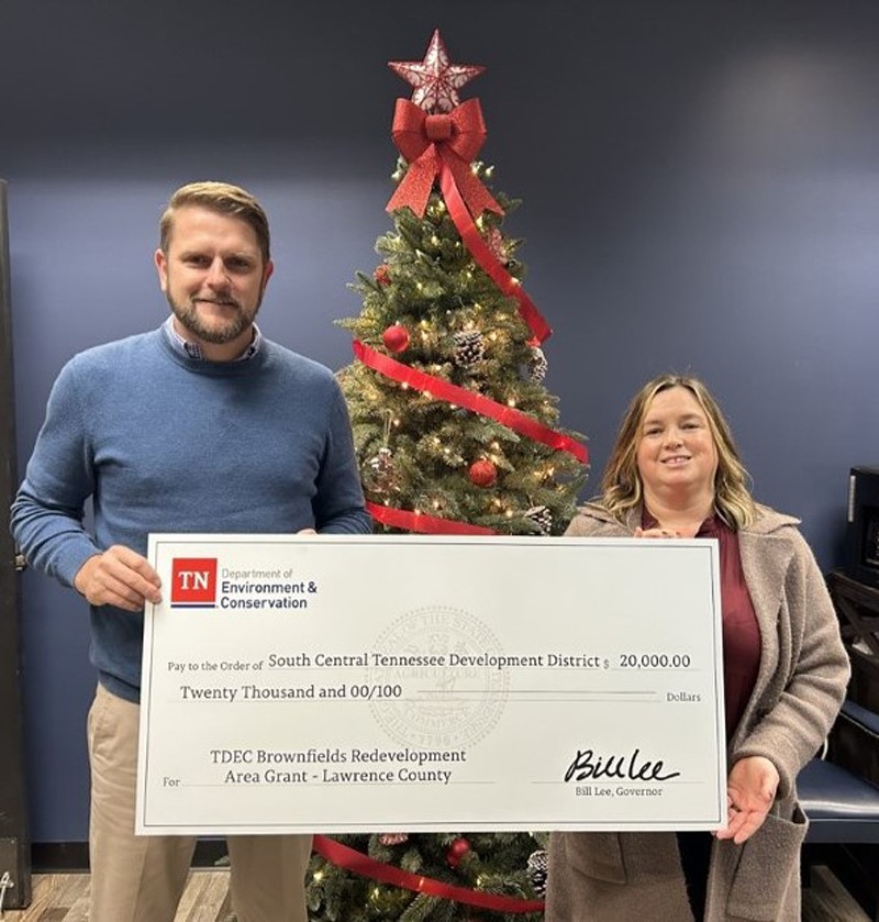The Tennessee Department of Environment and Conservation (TDEC) has presented a check for $20,000 to Lawrence County for its plans in brownfield redevelopment. Pictured here are David Morgan, county executive for Lawrence County, and Misti Baker, director of Solid Waste for the South Central Tennessee Development District.