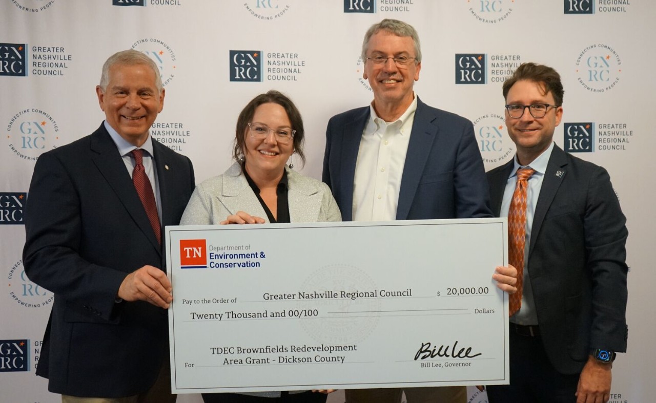 The Tennessee Department of Environment and Conservation (TDEC) presents a check for $20,000 to Dickson County for its plans in brownfield redevelopment. From left are Joe Pitts, mayor of Clarksville and chair of the Greater Nashville Regional Council, Tara Pedraza, director of Stakeholder Engagement for TDEC; Bob Rial, mayor of Dickson County; and Michael Skipper, executive director of the Greater Nashville Regional Council.