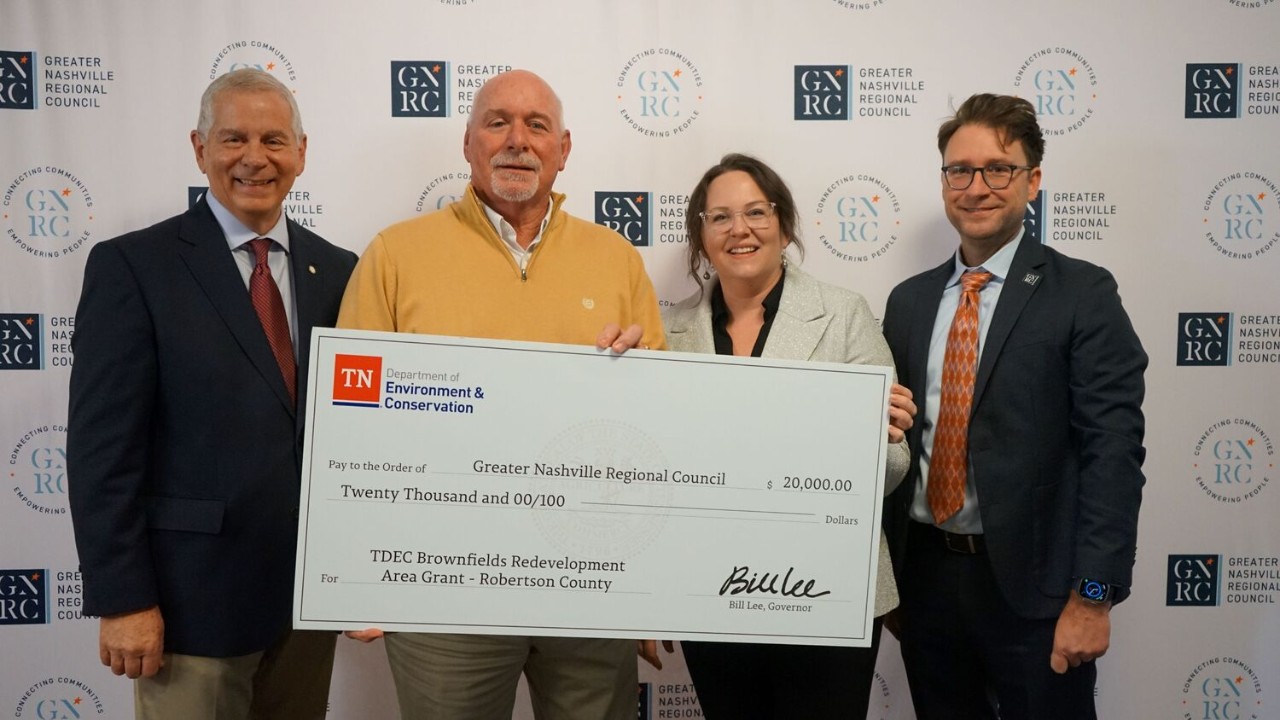 The Tennessee Department of Environment and Conservation (TDEC) presents a check for $20,000 to Robertson County for its plans in brownfield redevelopment. From left are Joe Pitts, mayor of Clarksville and chair of the Greater Nashville Regional Council; Billy Vogel, mayor of Robertson County; Tara Pedraza, director of Stakeholder Engagement for TDEC; and Michael Skipper, executive director of the Greater Nashville Regional Council.