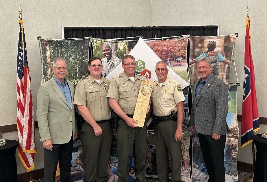 Johnsonville State Historic Park receives the Excellence in Resource Stewardship Award in the Tennessee State Parks annual Awards of Excellence. From left are Greer Tidwell, deputy commissioner for Conservation at TDEC; Ryan Forbess, Area 2 manager, Tennessee State Parks; Bob Holliday, park manager; Kim Moore, director of operations, Tennessee State Parks; and Chris Padgett, chief of staff and parks administrator.