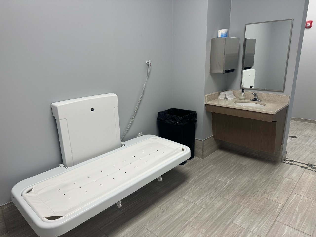 Tennessee State Parks changing table in a bathroom with gray walls