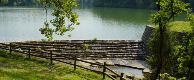 An open lake with a historic dam