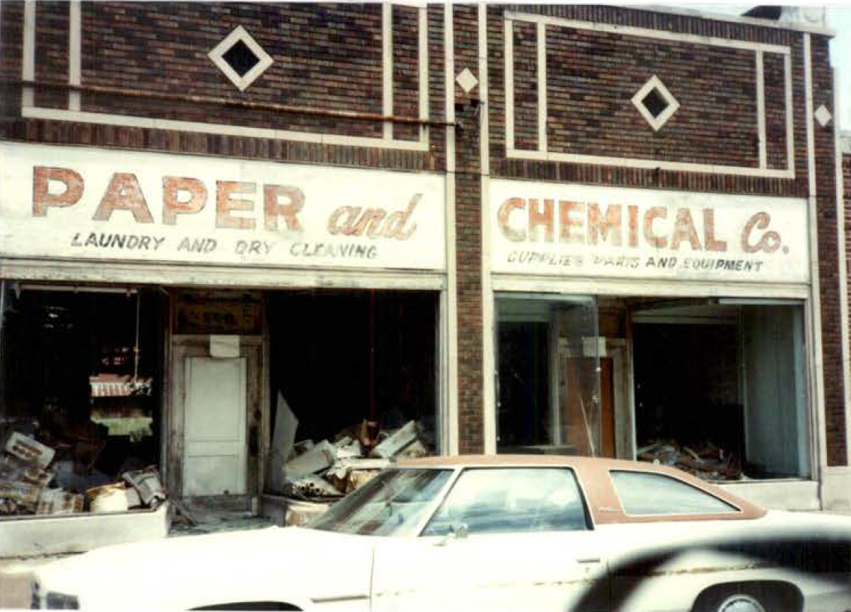 Building facade of the John Little Drum site. Building facade of the John Little Drum site featuring the National Paper and Chemical Company logo in the window.