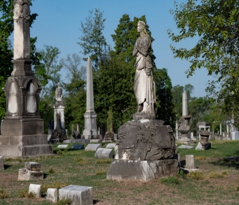 Mt. Olivet Cemetery in Nashville Mt. Olivet Cemetery in Nashville, TN, image features several decorative tombstones, including one of a lady standing with her arms crossed