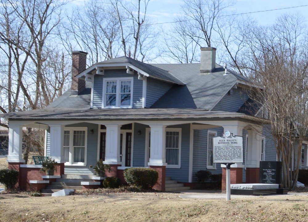 Image of the Alex Haley Home, a bungalow style home and a historical marker in front Alex Haley House State Historic Site in Henning, TN