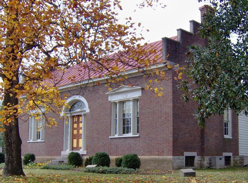 Image of Federal Style Home and autumnal trees in the background Carter House State Historic Site in Franklin, TN