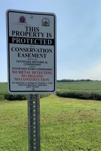 Tennessee Wars Commission Conservation Easement sign in a field TWC Easement Sign