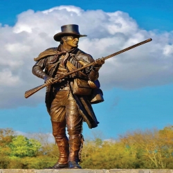 Image of a bronze metal soldier statue, titled the "Tennessee Volunteer" Image of a bronze metal soldier statue, titled the "Tennessee Volunteer"